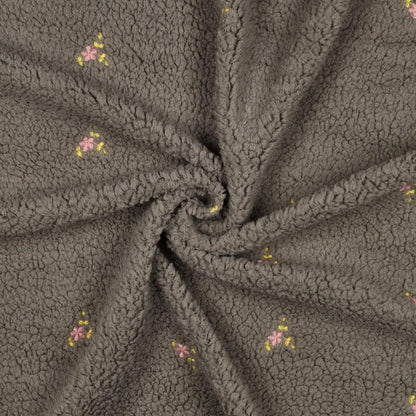 Teddy Stoff mit gestickten Blumen