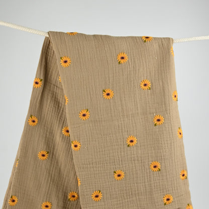 Musselin mit gestickten Sonnenblumen